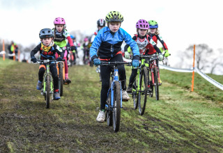 Young riders taking part in a cyclo-cross race